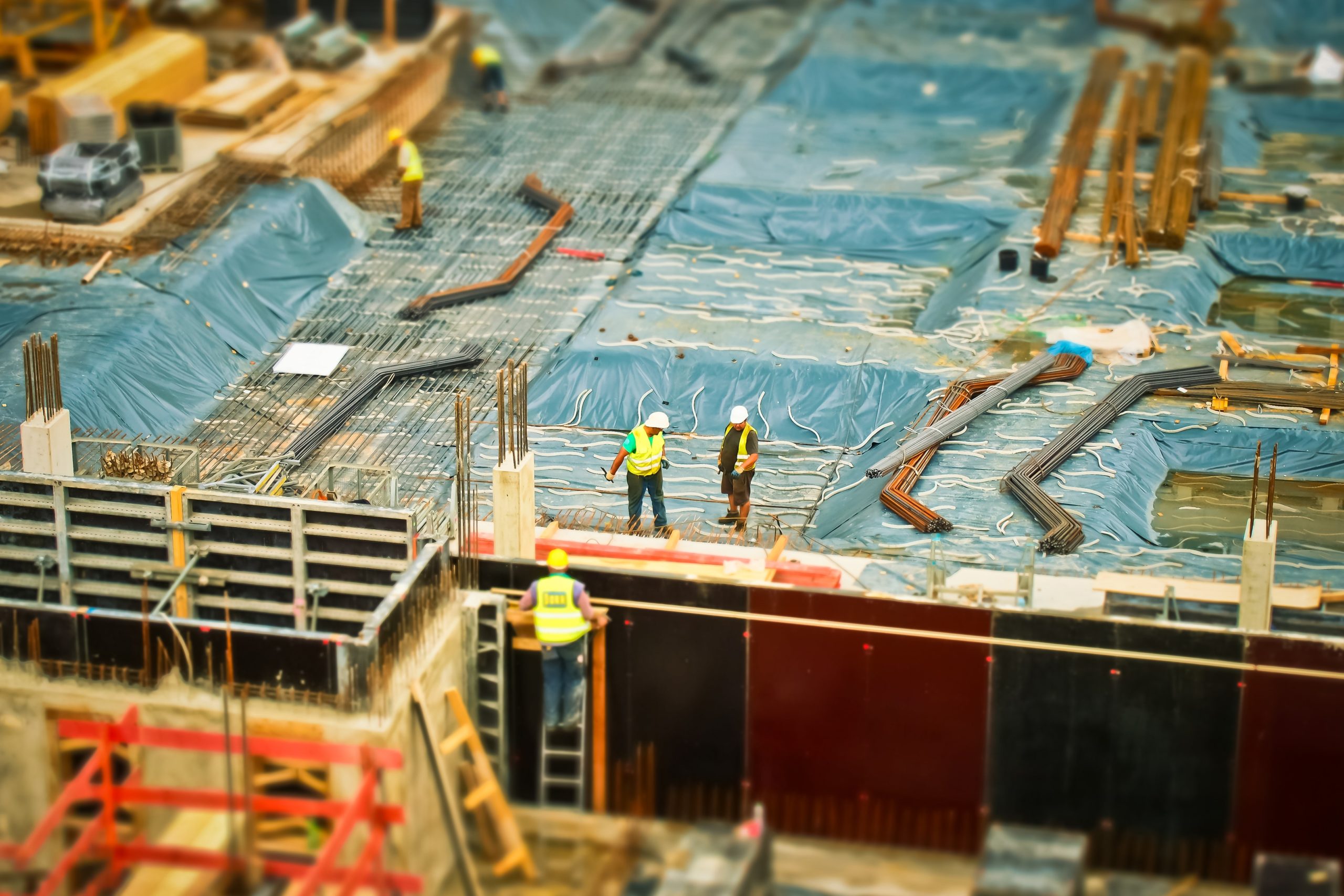 construction workers on top of the building