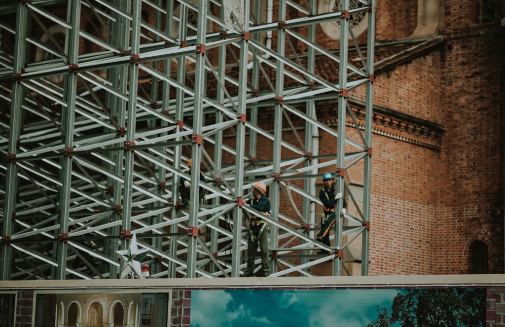ring scaffolding with two men with blue shirts